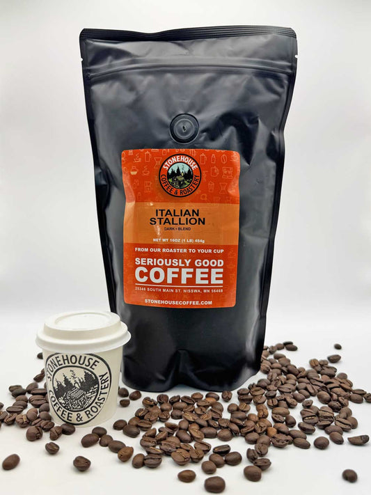 Stonehouse Coffee Italian Stallion bag with coffee beans and a cup on a white background