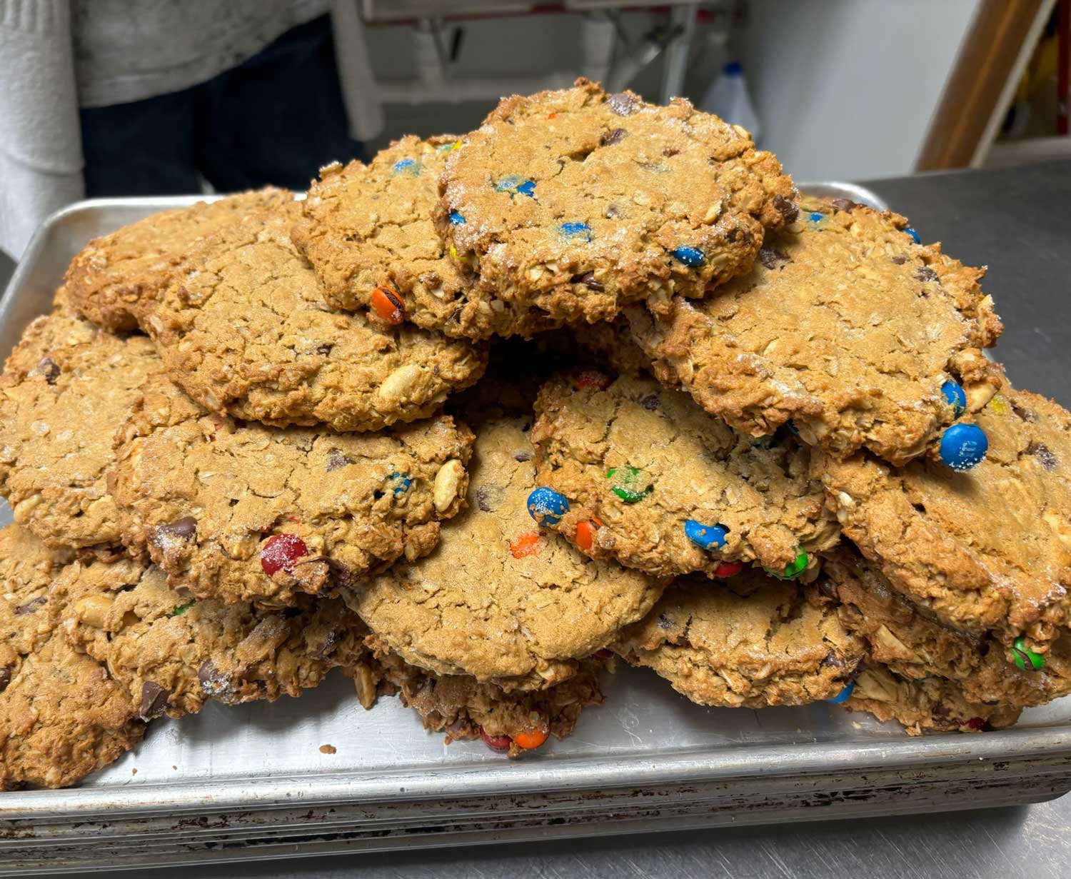 Fresh monster cookies in stack in bakery